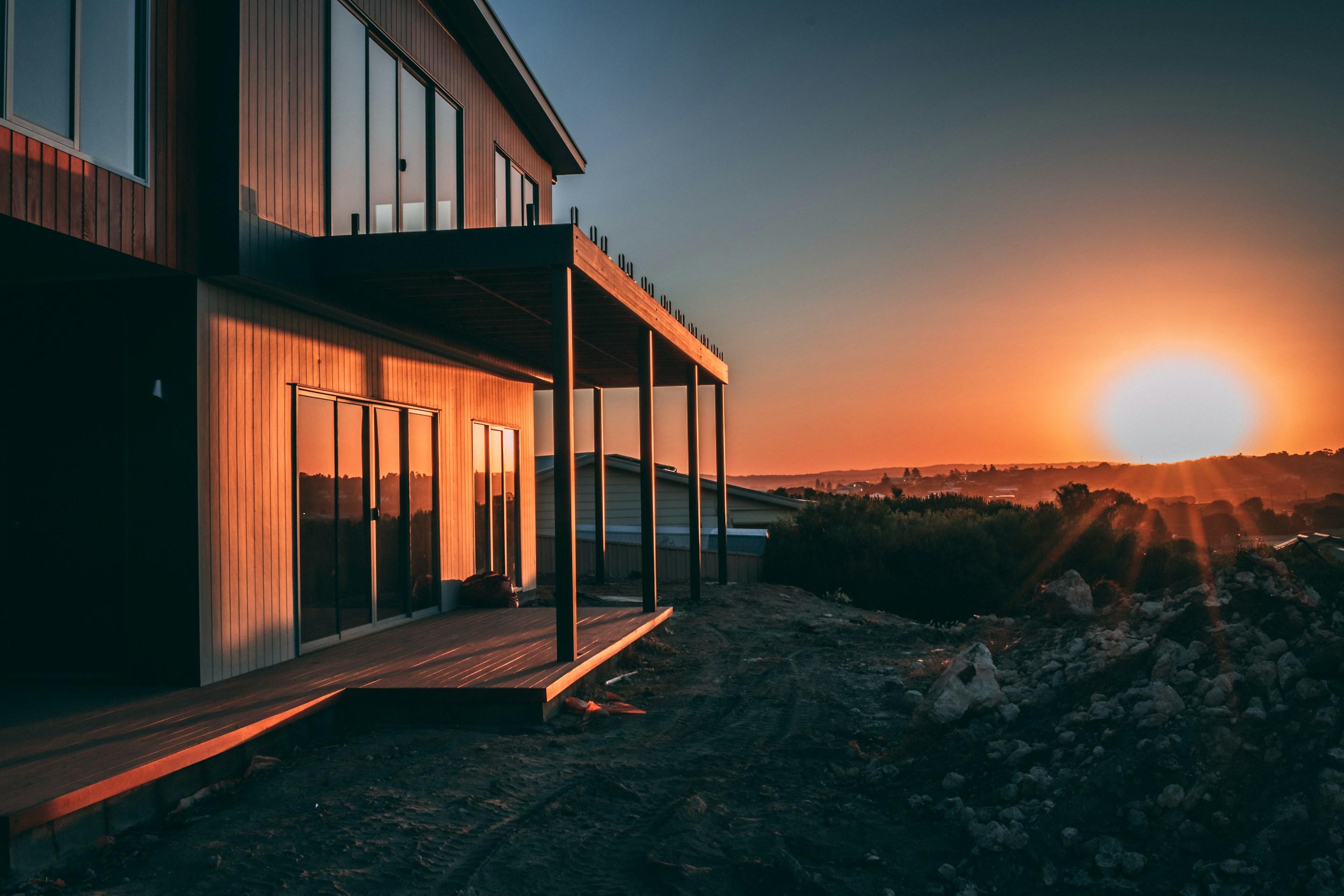 Low-energy timber home at sunset